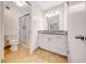 Well-lit bathroom features a glass enclosed shower, updated vanity, and tile floors at 1712 E Manhatton Dr, Tempe, AZ 85282