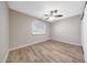 Nice bedroom boasting laminate floors, neutral walls, ceiling fan, and plenty of natural light from the window at 1712 E Manhatton Dr, Tempe, AZ 85282