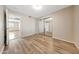 Comfortable bedroom with laminate floors, neutral walls, and a sliding closet reflecting the interior space at 1712 E Manhatton Dr, Tempe, AZ 85282