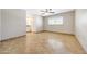 Open bedroom showcasing tile floors, neutral walls, a ceiling fan, and a window with natural light at 1712 E Manhatton Dr, Tempe, AZ 85282