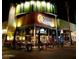 Modern restaurant exterior with outdoor seating, creating a welcoming and sophisticated dining atmosphere at night at 1712 E Manhatton Dr, Tempe, AZ 85282