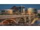 Twilight exterior shot of buildings and the bridge along the water at 1712 E Manhatton Dr, Tempe, AZ 85282
