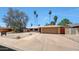 Charming single-story home with a two-car garage, low maintenance desert landscaping, and a welcoming entrance at 1712 E Manhatton Dr, Tempe, AZ 85282