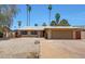 Charming single-story home with a two-car garage, low maintenance desert landscaping, and a welcoming entrance at 1712 E Manhatton Dr, Tempe, AZ 85282