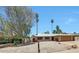 Charming single-story home with a two-car garage, low maintenance desert landscaping, and a welcoming entrance at 1712 E Manhatton Dr, Tempe, AZ 85282