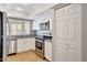 Kitchen showcases stainless steel appliances, white cabinets, and ample storage at 1712 E Manhatton Dr, Tempe, AZ 85282