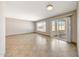Bright living area with tile floors, a sliding door, and views to the outside at 1712 E Manhatton Dr, Tempe, AZ 85282