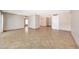 Spacious living room with tile flooring and neutral walls with multiple entryways for easy access at 1712 E Manhatton Dr, Tempe, AZ 85282