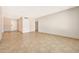 Bright living room with tile flooring, neutral walls, and a view of the entryway at 1712 E Manhatton Dr, Tempe, AZ 85282