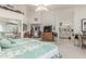 Spacious bedroom featuring a bed, sitting area and bathroom; plenty of natural light at 17543 N Rainbow Cir, Surprise, AZ 85374