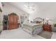 Cozy bedroom featuring a ceiling fan, neutral color palette, and a comfortable bed with decorative bedding at 17543 N Rainbow Cir, Surprise, AZ 85374