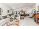 Bright living room with white sofas, wooden accents, and a cozy atmosphere at 17543 N Rainbow Cir, Surprise, AZ 85374