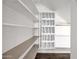 Organized walk-in closet with shelves and custom hanging racks for efficient storage at 1755 N 74Th Pl, Mesa, AZ 85207