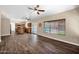 Spacious living room featuring hardwood floors and a view of the pool and backyard at 1755 N 74 Th Pl, Mesa, AZ 85207