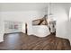 Open-concept living room featuring wood-look floors, staircase with wood railing, and plenty of space at 1755 N 74 Th Pl, Mesa, AZ 85207