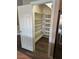 Organized pantry with shelves and wine rack for ample storage space at 1755 N 74 Th Pl, Mesa, AZ 85207