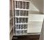 Walk-in pantry with adjustable white shelving and built-in wine rack at 1755 N 74 Th Pl, Mesa, AZ 85207