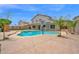 Beautiful backyard pool area, great for relaxing and entertaining, with a basketball hoop, complemented by desert landscaping at 1755 N 74Th Pl, Mesa, AZ 85207