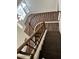 Top-down view of staircase with dark wood steps and banister at 1755 N 74 Th Pl, Mesa, AZ 85207