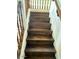 Well-lit wood staircase with white risers leading to the upper level at 1755 N 74 Th Pl, Mesa, AZ 85207