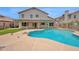 Refreshing pool area with ample space and seating, surrounded by a well-maintained backyard at 1755 N 74Th Pl, Mesa, AZ 85207