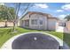 View of the rear exterior and backyard featuring artificial grass and a trampoline at 18998 E Lark Dr, Queen Creek, AZ 85142