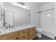 Bathroom featuring sleek vanity with quartz countertop, modern fixtures, and black hexagonal tile floor at 18998 E Lark Dr, Queen Creek, AZ 85142