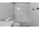 Bathroom showcasing a pristine white shower-tub combination and modern toilet in a well-lit space at 18998 E Lark Dr, Queen Creek, AZ 85142