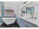 Modern bathroom boasts a freestanding tub, walk-in shower and dual sink vanity at 18998 E Lark Dr, Queen Creek, AZ 85142