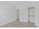 Spacious bedroom featuring neutral flooring and a view into a closet at 18998 E Lark Dr, Queen Creek, AZ 85142