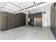 Spacious garage featuring ample storage cabinets and a neutral color palette, providing organized utility space at 18998 E Lark Dr, Queen Creek, AZ 85142