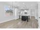 Kitchen with an island, stainless appliances, and natural light throughout at 18998 E Lark Dr, Queen Creek, AZ 85142