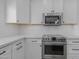 Close-up of kitchen showcasing stainless steel appliances and white subway tile backsplash at 18998 E Lark Dr, Queen Creek, AZ 85142