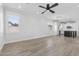Open-concept living room with kitchen, natural light, and ample space for entertaining at 18998 E Lark Dr, Queen Creek, AZ 85142