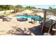 Resort style backyard with custom pool, spa, pergola, and multiple seating areas at 2041 E Palm Beach Dr, Chandler, AZ 85249