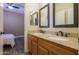 Bathroom with double sink granite vanity, ceiling fan and view into the bedroom at 2041 E Palm Beach Dr, Chandler, AZ 85249