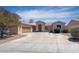 Charming single-story home featuring a circular driveway and well-maintained landscaping at 2041 E Palm Beach Dr, Chandler, AZ 85249