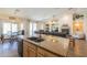 Open kitchen showcasing granite counters and stainless steel appliances flowing into the living room at 2041 E Palm Beach Dr, Chandler, AZ 85249