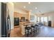 Well-equipped kitchen features an island with stools, modern appliances, and sleek finishes at 2041 E Palm Beach Dr, Chandler, AZ 85249