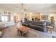 Spacious living room open layout with wood floors and comfortable leather seating at 2041 E Palm Beach Dr, Chandler, AZ 85249