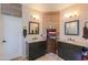 Elegant bathroom featuring dual vanities, modern lighting fixtures, and decorative wood paneling at 2041 E Palm Beach Dr, Chandler, AZ 85249