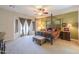 Spacious main bedroom boasts a four-post bed, ceiling fan, and French doors to the outside at 2041 E Palm Beach Dr, Chandler, AZ 85249