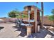 The outdoor kitchen features a built-in grill, bar seating, and patio heaters for year-round entertaining at 2041 E Palm Beach Dr, Chandler, AZ 85249