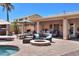 Covered patio with outdoor seating, lounge chairs, bbq, and firepit; perfect for entertaining or relaxation at 2041 E Palm Beach Dr, Chandler, AZ 85249