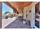 A long covered patio offers comfortable seating, ceiling fans, and access to the backyard pool at 2041 E Palm Beach Dr, Chandler, AZ 85249