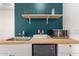 This charming kitchenette features stylish butcher block countertops, a microwave, and floating shelves at 22682 E Indiana Ave, Queen Creek, AZ 85142