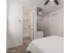 This bedroom has an en-suite bathroom featuring a tiled shower and convenient kitchenette at 22682 E Indiana Ave, Queen Creek, AZ 85142