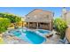 Stunning backyard oasis with a custom pool, attached spa, and covered patio ideal for entertaining guests at 24645 N 65Th Ave, Glendale, AZ 85310