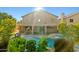 Resort-style backyard with a sparkling pool and spa, covered patio, and lush greenery for ultimate relaxation at 24645 N 65Th Ave, Glendale, AZ 85310