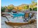 Inviting backyard with a custom pool, spa, and scenic mountain views, perfect for leisure and recreation at 24645 N 65Th Ave, Glendale, AZ 85310